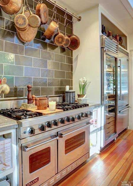 48-inch-Viking-professional-range-in-a-home-kitchen-with-copper-pots-and-pans-hanging-overhead