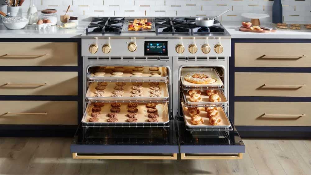 BlueStar dual-fuel range with gas burners and an electric oven, shown baking delicate pastries evenly.