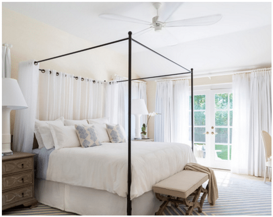 Minka Aire Iconic 60” Ceiling Fan in Bedroom.png