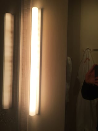 Sconces on either side of the mirror, Chamber Hotel