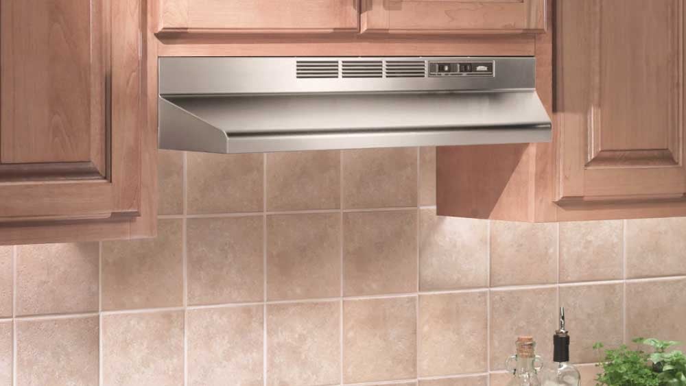Ventless range hood with charcoal filter above cooktop.