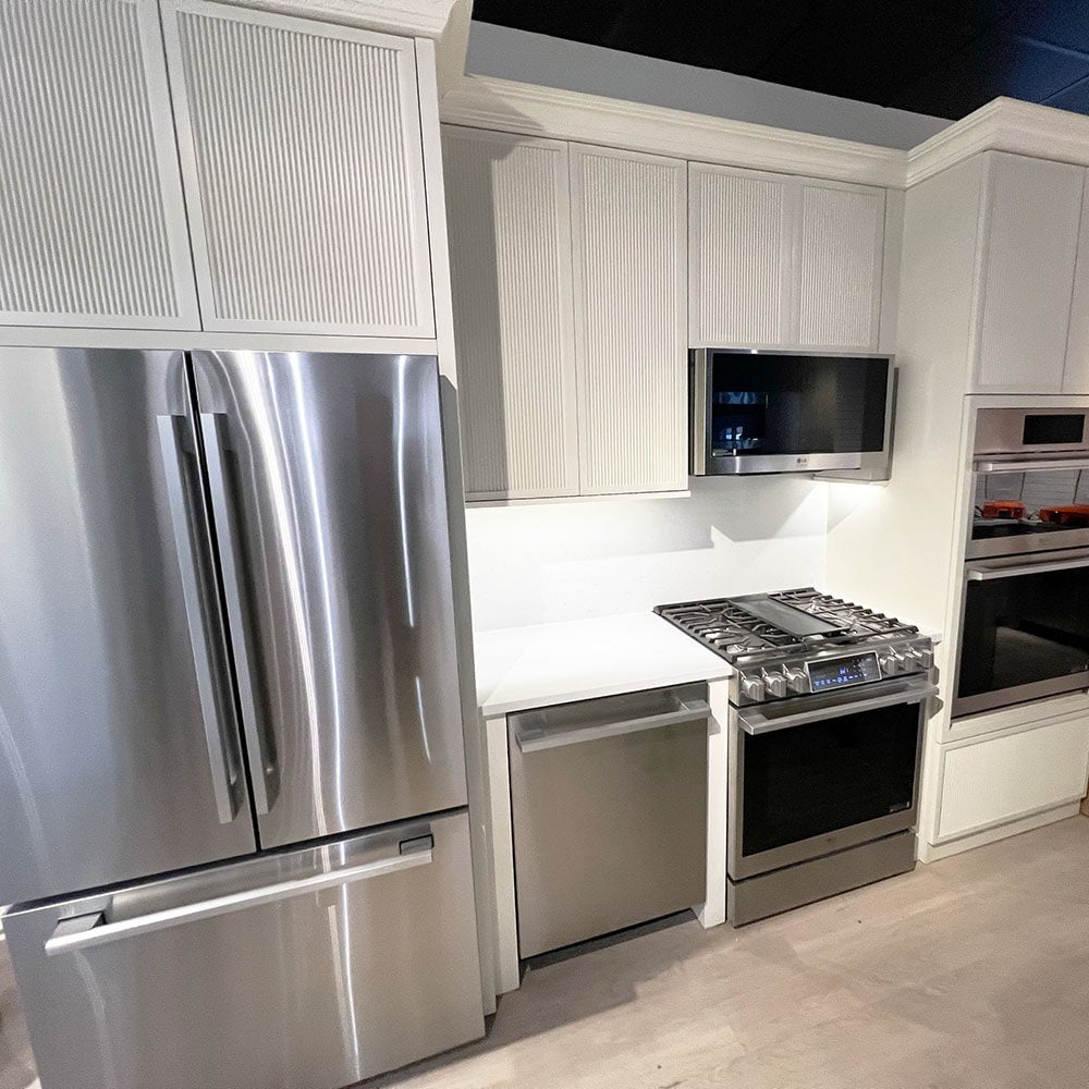 kitchenette-with-front-control-range-dishwasher-and-counter-depth-refrigerator-at-yale-appliance-in-hyannis